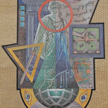 a mural of justice on the exterior wall at Cardiff Magistrates