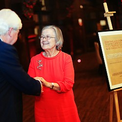 Lady Hale Huw Williams shaking hands with a man